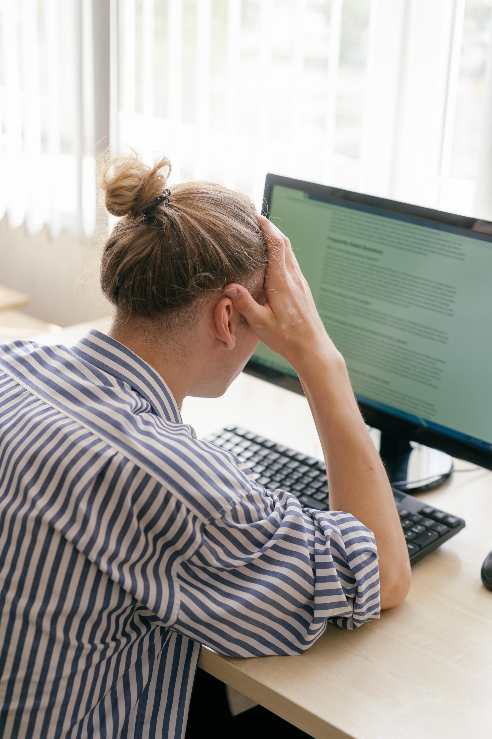 Man frustrated at computer